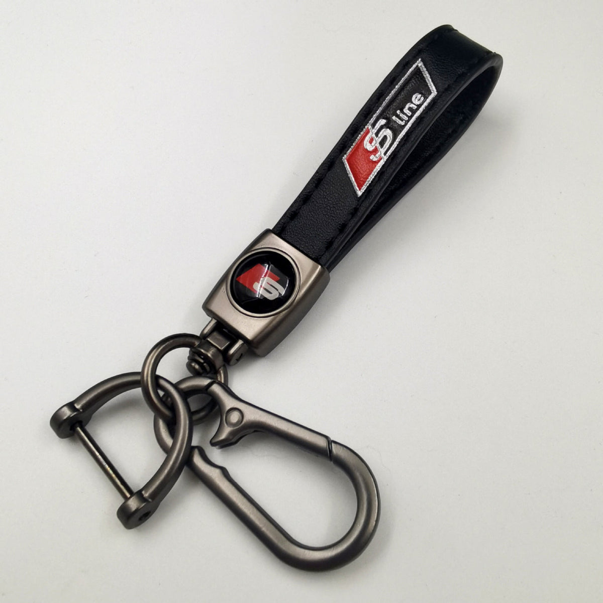 Sleek Black Leather Keychain – Red-Accented Emblem with Secure Metal Carabiner
